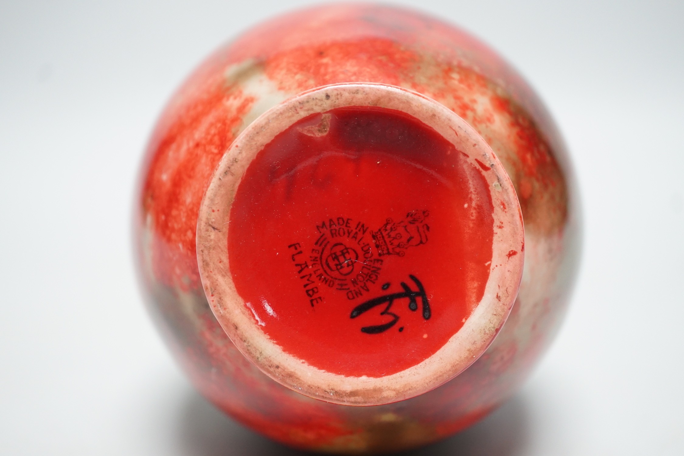 A Royal Doulton flambe vase by Fred Moore, 14cm